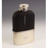 A silver mounted glass hip flask by Tiffany & Co, the colourless glass body