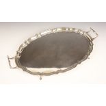 A George VI twin handled silver tray, Barker Brothers Silver Ltd, Birmingham 1939, the oval tray