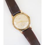 A vintage gentleman's Everite 9ct gold wristwatch, the circular cream dial with gold coloured Arabic