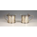 A pair of George V silver wet mustards, Jones & Son, London 1935, of cylindrical form with reeded