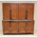 A 19th century scumbled pine housekeepers cupboard, formed with an arrangement of four cupboard