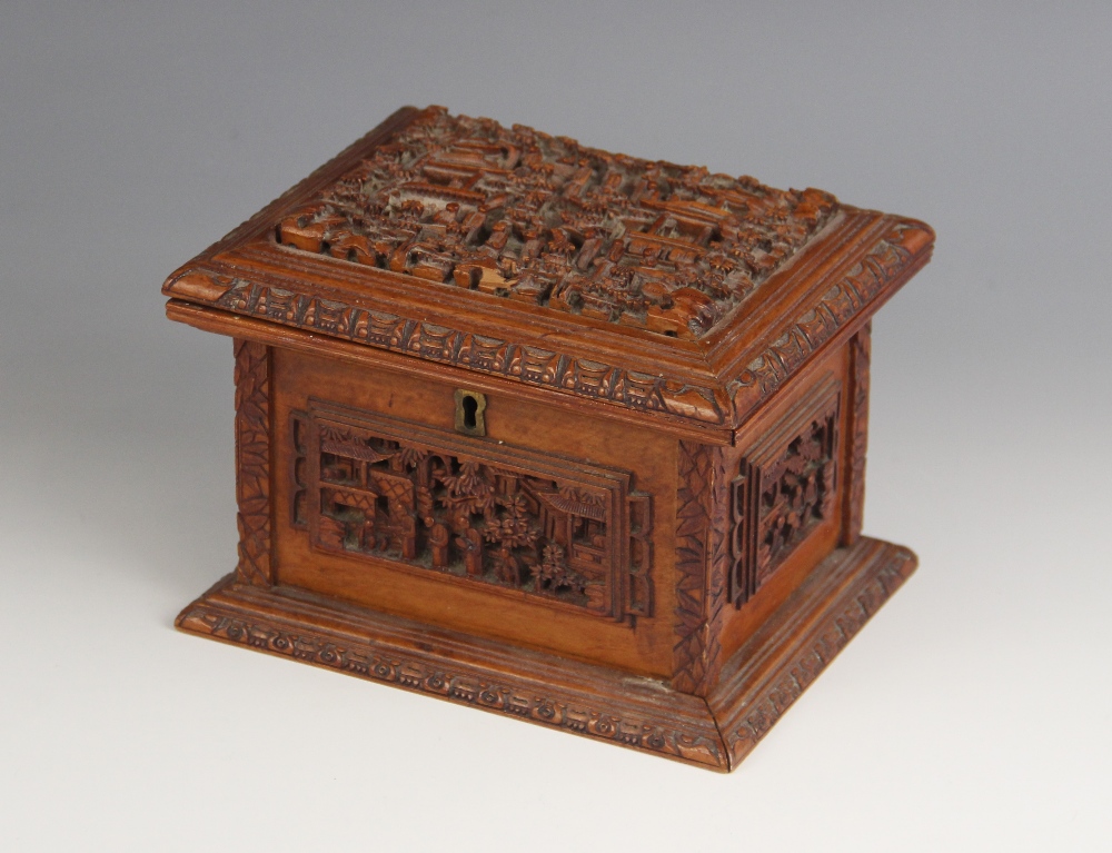 A Chinese carved sandal wood box, late 19th century, the rectangular box with hinged cover carved