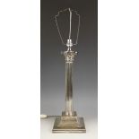 A silver plated Corinthian column lamp base, of typical fluted form, the column extending to an