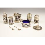 An assorted collection of condiments to include; An Edwardian silver wet mustard, Atkin Brothers,