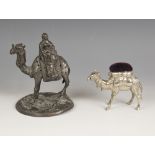 A novelty spelter tooth pick stand modelled as a camel, early 20th century, designed with a figure