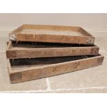 Three 'Country Maid' pine bakers trays, each applied with metal corner brackets and makers name to