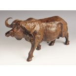 David Mudede (Zimbabwean 20/21st century), carving of a cape buffalo, modelled walking, signed to