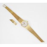 A 9ct gold ladies Omega wristwatch, the central circular white dial with baton markers, set to a