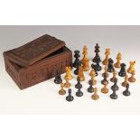 A Staunton pattern box wood and ebonised chess set, 20th century, comprising thirty one matching