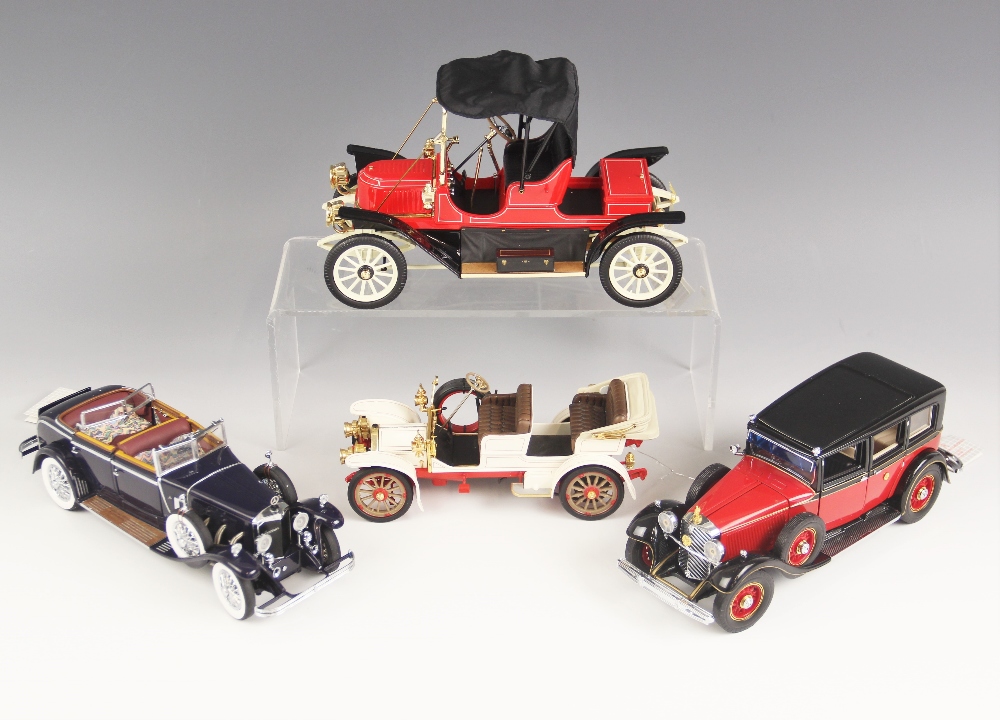 A boxed Franklin Mint 1/16 scale die-cast model of a 1911 Stanley Steamer with fabric hood, together