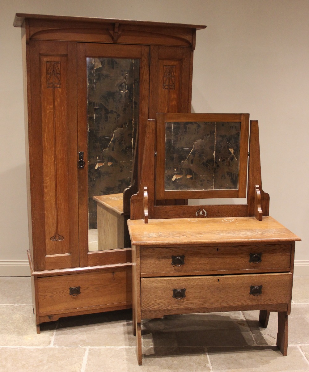 An Arts & Crafts three piece bedroom suite, early 20th century, comprising; a honey oak single