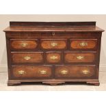A George III oak and mahogany crossbanded Lancashire mule chest, the hinged top with a rear