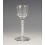 A Georgian double series opaque twist liqueur glass, bell shaped bowl supported by a four ply spiral