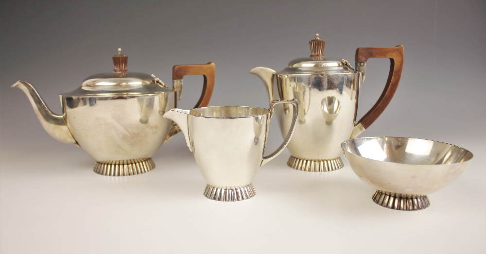 A George VI silver tea service, Wakely & Wheeler, London 1941, comprising a teapot, hot water jug,