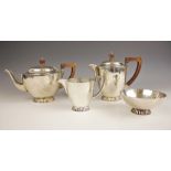 A George VI silver tea service, Wakely & Wheeler, London 1941, comprising a teapot, hot water jug,