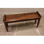 A Victorian oak window seat/hall bench, late 19th century, the rectangular moulded top with canted