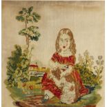 A Victorian wool work embroidered picture, late 19th century, depicting a seated young girl stroking