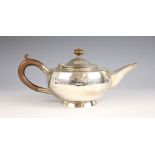 A George V silver teapot, Hukin and Heath Ltd, Birmingham 1924, of compressed globular form on