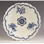 A Worcester junket dish, circa 1770, transfer printed in underglaze blue in the Natural Sprays