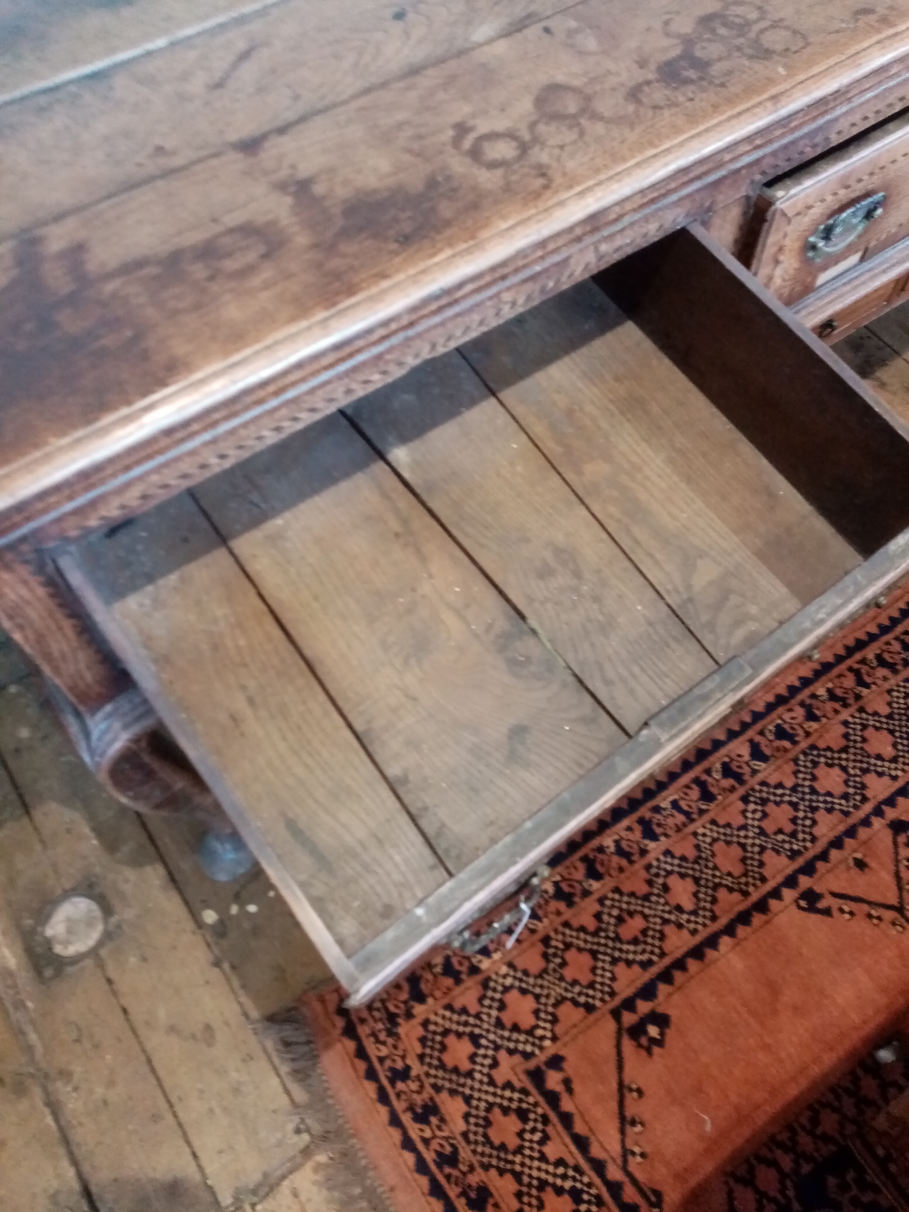 A George III oak dresser base, the rectangular moulded three plank top above three lip moulded - Image 12 of 15