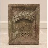 A late 19th century sandstone date block, of rectangular form with raised rim, carved in relief with