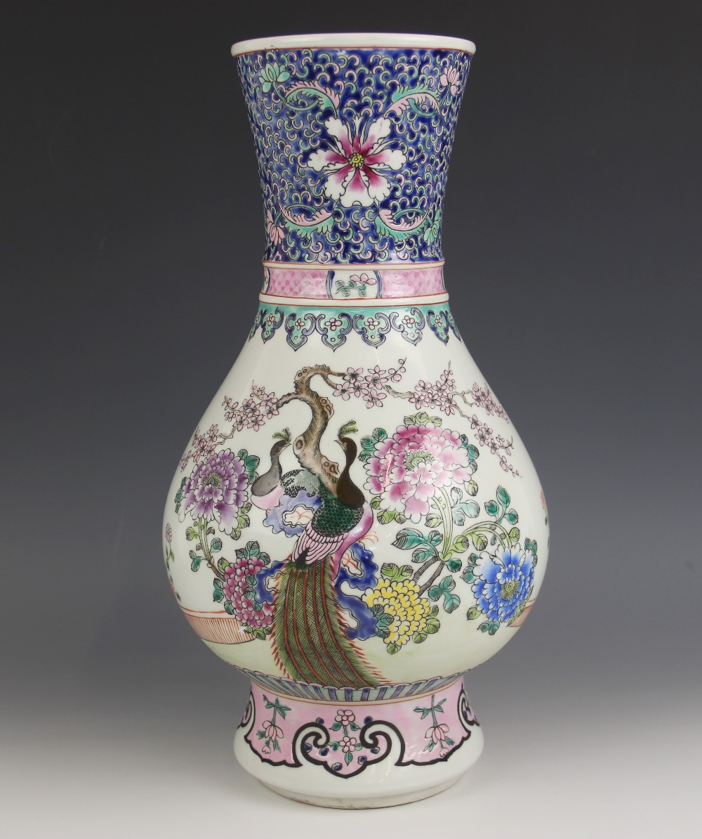 A Chinese porcelain famille rose 'Peacock' vase, Kangxi six character mark, painted with two