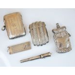 A George V silver vesta case, Chester 1912, the rectangular body with engine turned decoration and