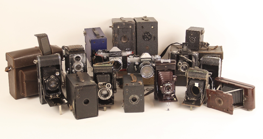 An extensive collection of vintage cameras and photographic equipment, to include a Praktica L SLR