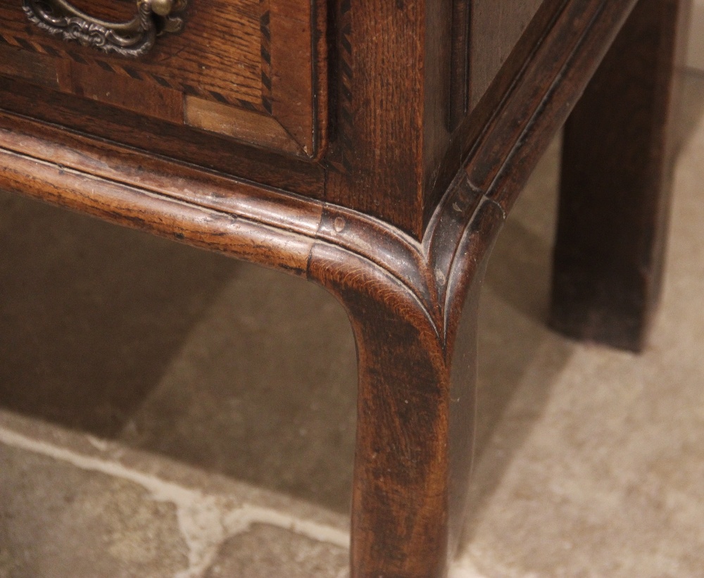 A George III oak dresser base, the rectangular moulded three plank top above three lip moulded - Image 3 of 15