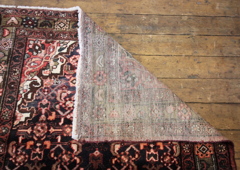 A Persian Hamadan runner, in deep brown and red colourways, the central foliate lozenge shaped - Image 2 of 2