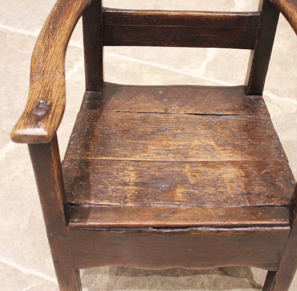 A Welsh oak child's primitive chair, late 18th/early 19th century, the rail back above open arms and - Image 3 of 3