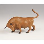 A cold painted bronze model of a bull, 10cm long
