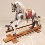 A dapple grey 'coach sprung' rocking horse in the manner of F. H. Ayres, early 20th century,