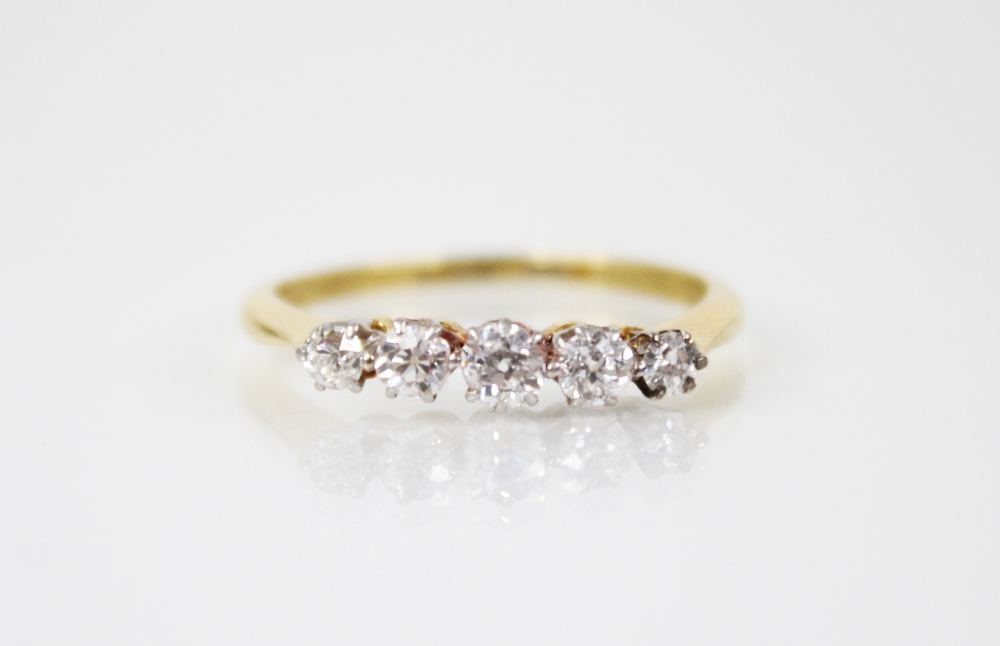 A diamond five stone ring, comprising five graduated round old cut diamonds, measuring between 2.5mm