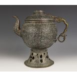 An Eastern brass kettle/ewer, of ovoid farm, embossed with Persian type foliate detail, applied with