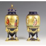 A pair of Vienna porcelain urn vases and a cover, early 20th century, each ovoid vase finely