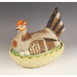 A Staffordshire pottery hen dish and cover, 19th century, the cover realistically decorated in