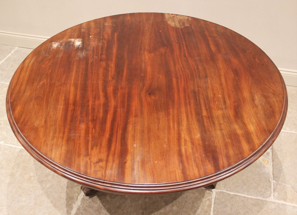 A mid 19th century mahogany centre table, the circular moulded top upon a triform pedestal applied - Image 2 of 2