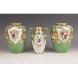 A Noritake vase, of two handled form, decorated with flowers against a green, white and gilt ground,