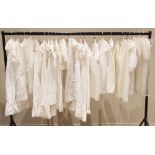 A large collection of Edwardian and later christening gowns and dresses, to include; three early