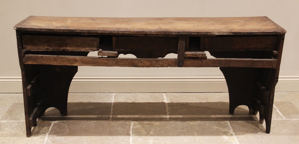 An elm and oak dresser base/work bench, 18th century and later, the plank top over three frieze - Image 2 of 2