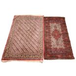 A Persian pattern rug, in pink and ivory colourways, the border with stylised bird motifs