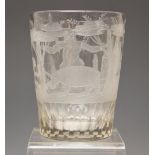A clear glass tumbler, probably German, 19th century, the straight sided tumbler engraved with a