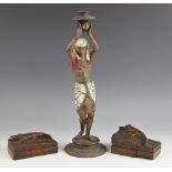 A cold painted spelter Egyptian Revival candlestick, late 19th or early 20th century, modelled as an