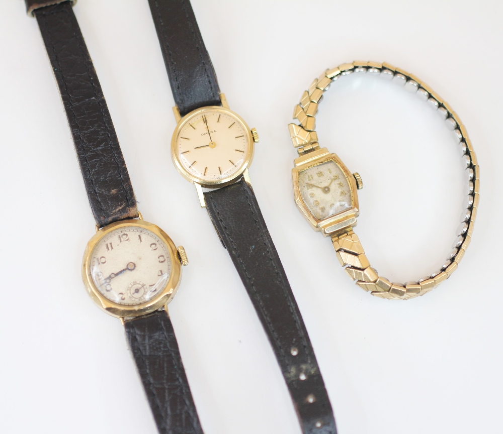 A ladies vintage 9ct gold Omega wristwatch, the circular champagne coloured dial with baton markers,