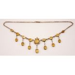 A mid-20th century citrine and seed pearl fringe necklace, designed as nine graduated oval cut