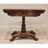 A William IV mahogany games table, the rectangular folding top with rounded corners opening to a