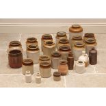 A collection of twenty five assorted glazed stoneware jars and pots, the largest 27cm high