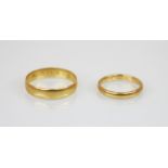 A 22ct gold wedding band, marks for 'SH' Birmingham, date mark indistinct, ring size S 1/2