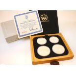 A sterling silver cased 'Olympic coin proof set' minted by The Royal Canadian Mint, the coins